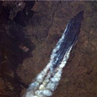 Birds-eye view: Canadian astronaut Chris Hadfield, aboard the International Space Station, took this photo of a bush fire burning near Burrinjuck Dam in New South Wales on Thursday while passing over Australia. Australians warned to expect more heat waves