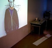 Self refelctive: The installation by Taro Izumi shows a video of the artist creating a work that can be found on the opposite wall of the same room. Digital, rough and maybe deadly