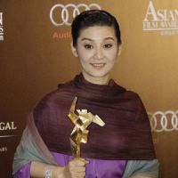 Helping hand: Chinese actress Xu Fan, after winning in the best actress category at the Asian Film Awards for her role in “Aftershock.” The film’s investors have pledged $76,000 for Japanese earthquake relief efforts. Asian stars lend their support to quake relief at film awards