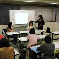 Kazuko Nagai (left), the founder of I’M Personal College, heads a classroom discussion (above) about plans for the graduation party (below) held on March 31. Women flock to join 'college of change'