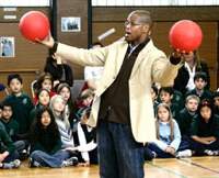 Motivational speaker Kevin Carroll uses red rubber balls to represent life ambition in a talk at the Tokyo International School. Red rubber balls foster fun, motivation and life's sense of adventure