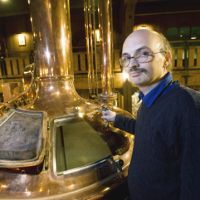 Johannes Braun, brewmeister at Otaru Beer, poses next to a copper brewhouse he brought over with him from Germany at Soko No. 1, the brewery-cum-beer hall he runs in Otaru, Hokkaido. German braumeister puts Otaru brewery on map