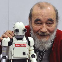 Man of many parts: Micky Curtis and a model of the robot outfit he wears in his latest movie, “Robo-G.” Mickey Curtis: from rocker to 'Robo-G'