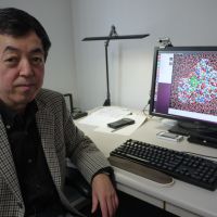 Digital health: Professor Hideaki Fujitani, a bio-computing expert at the University of Tokyo, shows an all-atom simulation video used in drug development. Drugs of the future will be computer-designed