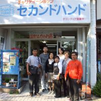 Cathy Hirano, director of the Second Hand charity organization, poses with workers at a shop run by the group in Takamatsu, Kagawa Prefecture. Cambodia experience facilitated aid effort in the Tohoku region