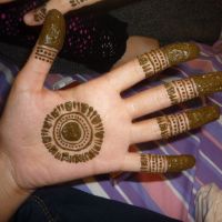 Henna gaijin: Traditional Pakistani mehendi temporary tattoos are applied using henna in preparation for Eid. False eyelashes, an authentic Eid, but we're not in Karachi anymore