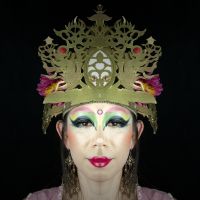 Eye-stopping: A symmetrical image of a volunteer bodhisattva created after artist Tetta’s making-up by flipping one side of a photo of her face to form the other side. Artist creates Yokohama bodhisattvas