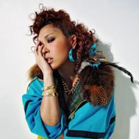 AI carumba: R&B singer AI poses for a press shot She, herself and AI