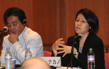 Jane Nakano (right) from the Center for Strategic and International Studies talks about global demand for nuclear energy during a June 13 seminar in Tokyo while Akihiro Sawa with the 21st Century Public Policy Institute listens. Global demand for nuclear power remains high