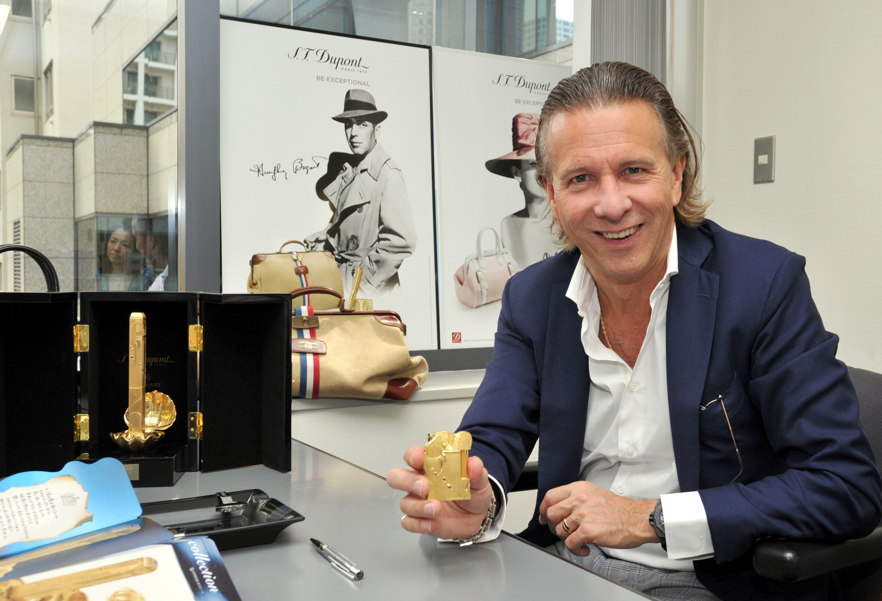 The right light: S.T. Dupont CEO Alain Crevet holds a lighter designed by Eiichiro Oda, the author of the popular manga “One Piece,” at the firm’s Tokyo office in Minato Ward on Sept. 28. S.T. Dupont excels amid steady growth in luxury brand market