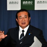 Taking some heat: Kenji Yamaoka, head of the Consumer Affairs Agency and the National Public Safety Commission, is interviewed Tuesday in Sanno Park Tower in Tokyo. Despite pyramid sales donations, new consumer chief vows to run tight ship
