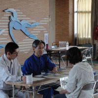 DIY crisis management: A female resident of Date, Fukushima Prefecture, gets advice on decontamination steps on Oct. 18. Locals borrow equipment to do own decontamination work