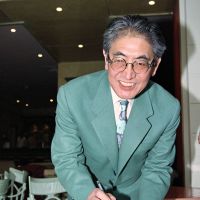 Movie director Nagisa Oshima signs a cast of his hands during the Ninth International Festival of Audio-Visual Programs in January 1994 in Cannes, France. Oshima died Tuesday at the age of 80. Nagisa Oshima: a leading force in film