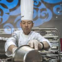 Piece de resistance: Noriyuki Hamada whips up an entry in the finals of the Bocuse d’Or international culinary competition Wednesday in Lyon, France. Japan chef wins medal at top culinary contest