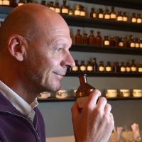 Nose for talent: British perfumer Mark Buxton smells perfume in a bottle at his workshop in Paris. Niche perfumers infuse Paris with new options