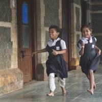 Boys first: Schoolgirls play in Mumbai’s Bandra Station as they wait to catch a train Wednesday. A new study says India’s swelling urban middle class may be using illicit sex-selective practices. India's doctors using illegal sex-selection in own families