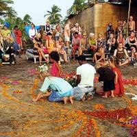 Prayer meet: Foreign tourists take part in a ceremony for British teenager Scarlett Keeling on Anjuna beach in Goa, India, days after she was raped and left for dead in February 2008. Indian court drags feet in '08 rape case