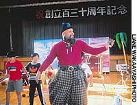 Ramsey King Montana takes a break from the drums to get the kids on their feet at an elementary-school gym in Setagaya ward. For special kids, his music is the message