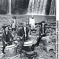 Murdo Maclean (center) and fellow performers drum it out in front of Harajiri Falls in Ogata with two local Kagura performers. Living like a local