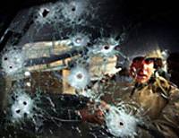 Private Eric Ayon of Echo Company of the second batallion, Fourth Regiment of the US marines stares through the bullet-ridden windshield of a Humvee ambushed at Ar Ramadi,Iraq, on April 6. Second prize general news singles in the World Press Photo exhibition. World Press prizewinning photos get to the heart of the story