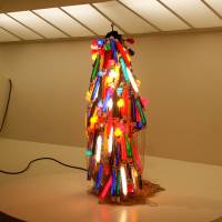 Bright lights in New York City: Atsuko Tanaka’s “Electric Dress” (above) of painted incandescent light bulbs, electric cords and a control console (1956, refabricated in 1986), from the collection of the Takamatsu City Museum of Art. In New York, the Guggenheim goes Gutai