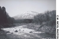 Theo Tori River (with Kurohime mountain behind) in 1998, three years after river construction (above); The same view from my study last month shows the bouldered banks’ tree growth. Apres le deluge