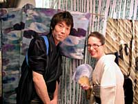 Maia Maniglier poses with kimono stylist Kanji Nakashima at their first exhibition in Tokyo in May 2003. Behind them are yukata designs by Hiroshi Goto and Tatsuya Oka. Opening the kimono to everyone