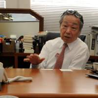 Pressing issue: Hidetoshi Masunaga, an elite lawyer who is spearheading a campaign to rectify “discrimination based on a voter’s address,” displays one of more than 100 full-page opinion adverts his group has run in the vernacular media. Hidetoshi Masunaga: making revolution through the Constitution