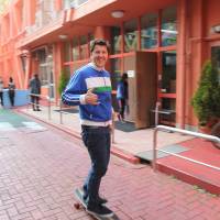 Patrick Newell, 47, founder of Tokyo International School, demonstrates his main mode of transportation in the crowded capital. Founder of TIS makes creativity cornerstone of school's curriculum
