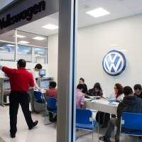 Giving kids a run for their money: Students from a middle school in Fairfax, Virginia, participate in a financial-literacy program that includes exercises on mortgages, paying bills and applying for credit. Here, they gather in the Volkswagen storefront for information on car-buying. Teach your teens basic life skills