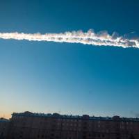 A meteorite contrail is seen over the Russian city of Chelyabinsk Friday morning. Meteor shower injures hundreds in central Russia