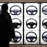 Guiding light: Steering wheels for Lexus vehicles are displayed during the Tokyo Auto Salon 2013 at the Makuhari Messe convention hall in Chiba on Jan. 11. Toyota top brand among Japanese firms globally