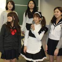 Local attraction: Five students from Nagoya City University wearing a variety of uniforms give a presentation on Japan’s “cosplay” culture during an English tour guide contest held at the university. 'Cosplay' students promote Nagoya's highlights