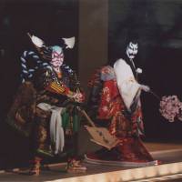 The ghost of Seigen, played by Nakamura Fukusuke IX holds out a branch of cherry blossoms as she is subdued by the warrior Awazu no Rokuro (Nakamura Kanjaku) in Act IV of “Sumidagawa Hana no Goshozome” (“The Sumida River Adorned with Cherry Blossoms”). A lovesick nun, magic sandals and a vengeful ghost