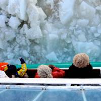 Ice blocks: Tourists lean out the Icebreaker Aurora II to better hear the haunting crush of drift ice as the ship grinds through. Abashiri astounds with its ice and convict connections