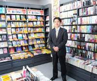Author of change: Hiroshi Sato, president and chief executive officer of secondhand book trader Bookoff Corp., poses at an outlet in Sagamihara, Kanagawa Prefecture, last month. Bookoff chief guides firm out of attitude bind