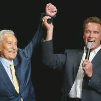 Father of fitness: Then-California Gov. Arnold Schwarzenegger raises the arm of Joe Weider, creator of Mr. Olympia Bodybuilding competition, during the 39th annual Mr. Olympia event in Las Vegas on Oct. 25, 2003. Joe Weider, 'godfather of fitness' dies at 93