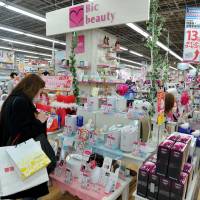Electrifying: A woman checks out skin moisture products at a Bic Camera store in Chiyoda Ward, Tokyo, on March 18. Appliance makers get serious about beauty products