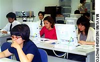 Participants in a recent Okinawa Labor Bureau employment seminar at the Okinawa Industrial Support Center in Naha use the Internet to hunt for jobs. Okinawans look to tackle problems on own terms