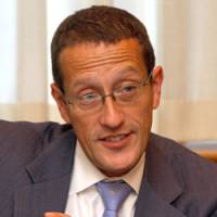 CNN anchor Richard Quest speaks about his on-the-cheap Japan visit in Tokyo on Nov. 16. Timid he's not, CNN's Quest calls them out as he sees them