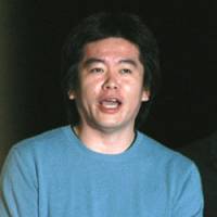 Livedoor founder Takafumi Horie, arrested on charges of violating securities laws, leaves the Tokyo Detention House last April on 300 million yen bail. Innocence is presumed but bail is not a given