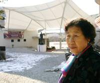 Looking for closure: Wartime sex slave Kang Il Chul stands in the courtyard of Sharing House, a commune and museum in Gyeonggi Province, South Korea, for former “comfort women.” Sex slaves struggle to keep plight in focus