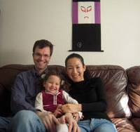 All smiles: Philippe Lavoie and Satoko Yamagishi pose for a family photo at home with their daughter, Miyabi, in January. Long-shot meeting, longtime love