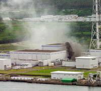 Burning issue: Smoke rises from a burning electrical transformer near the Kashiwazaki-Kariwa Nuclear Power Station in Niigata Prefecture in July 2007 following a strong earthquake. Nuke power gets another look, but concerns persist