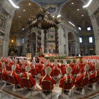 Mass gathering: Cardinals attend a Mass in St. Peter's basilica before the start of the conclave on Tuesday. What's in a name? A lot if you're pope