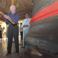 Going to bat for democracy: Former U.S. President Jimmy Carter gets ready to hit a giant bell during his visit to Yangon’s famed Shwedagon Pagoda on Friday. Carter arrived Tuesday to support Myanmar’s ongoing democratic transition. Myanmar's chaos fated in pursuit of democracy