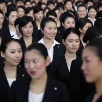Flying high: While these new recruits with Japan Airlines are now gainfully employed, many single women in Japan struggle to survive on low salaries. The life and times of the destitute girl