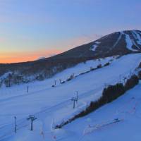 Sunrise after a blizzard reveals deep powder on the so-called Sailer side of Mount Appi. Appi's snowy joys await seekers of late-season thrills