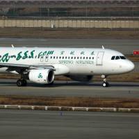 Holding pattern: A Spring Airlines jet taxies at Shanghai Pudong International Airport in February. The Chinese low-cost carrier is freezing plans to expand flights to other Japanese cities. Spring Air freezes Japan expansion plans over Senkakus turmoil