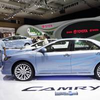 Shiny new: A booth attendant polishes a Toyota Motor Corp. Camry hybrid vehicle at the Indonesia International Motor Show in Jakarta last September. Altima tops Camry in hot U.S. midsize market